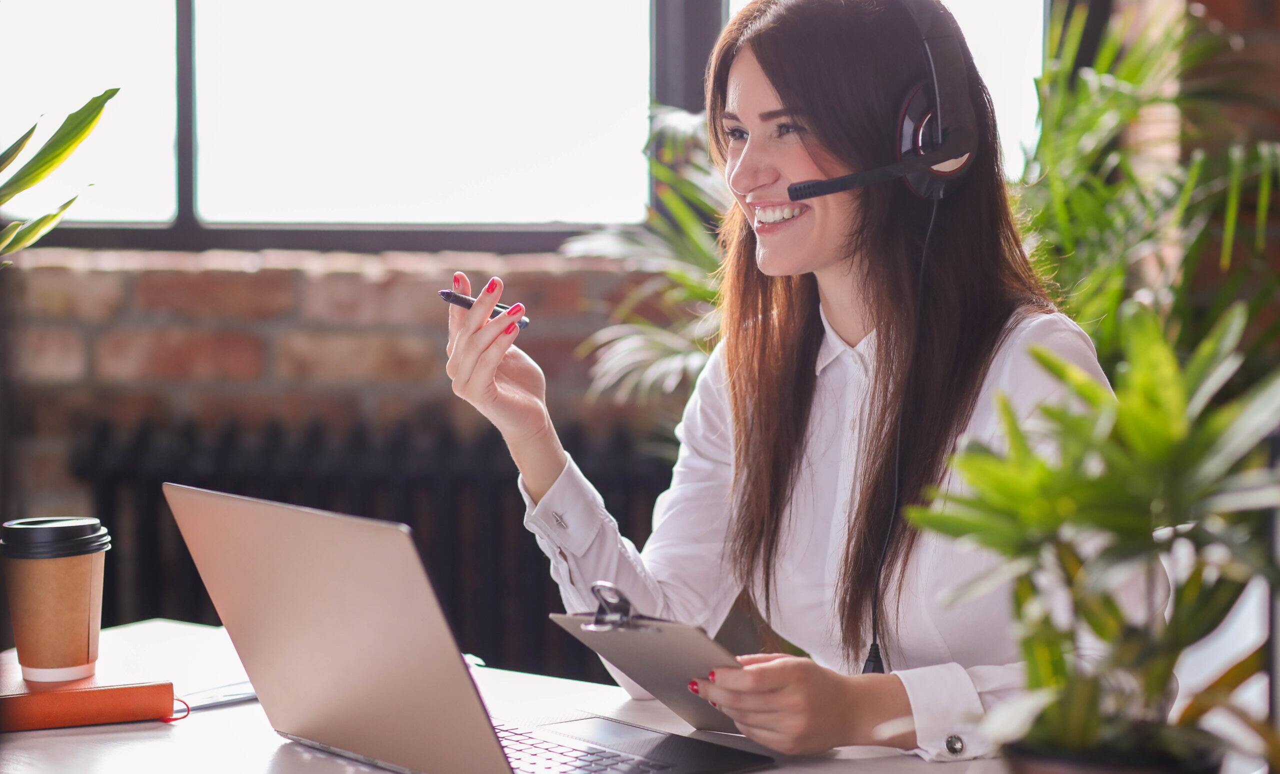 Woman working in call center as dispatcher