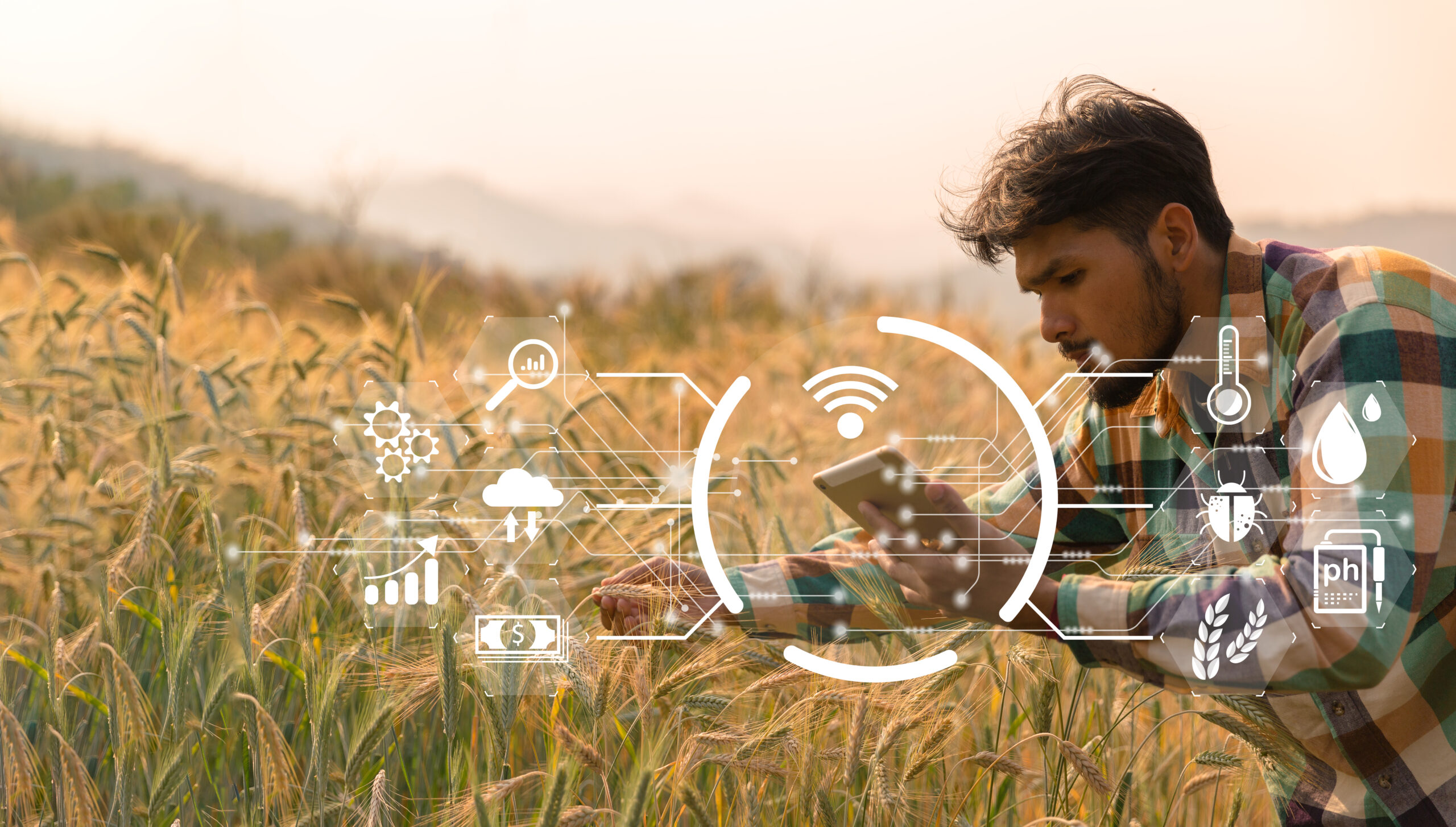 Smart farming concept. Farmer with technology digital tablet on background of wheat field. Professional farmers use internet of things (IOT) computers system to manage farms. agriculture modern idea.